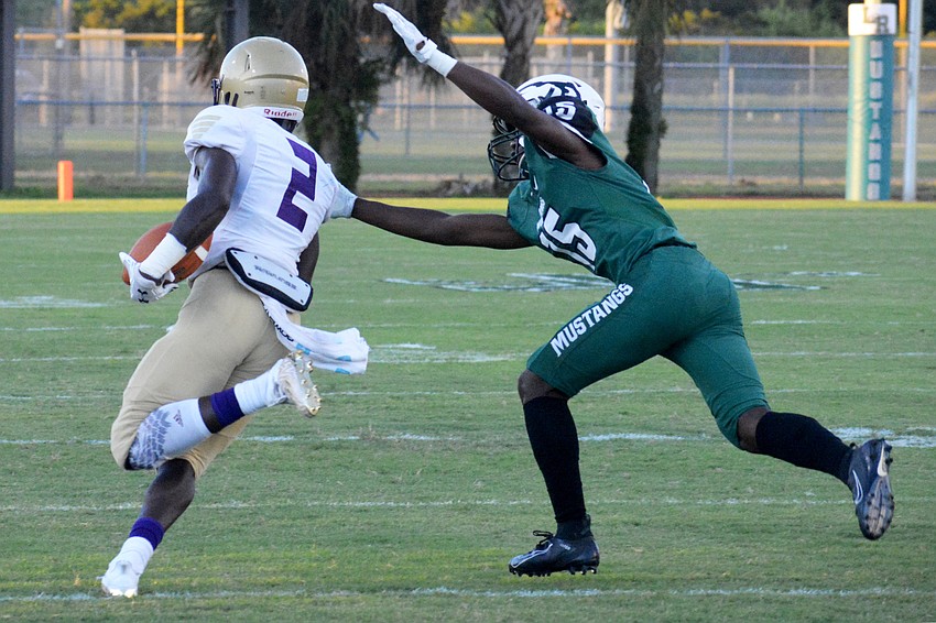 Booker senior running back Dejuan Gordon bursts past a Mustangs defensive back.
