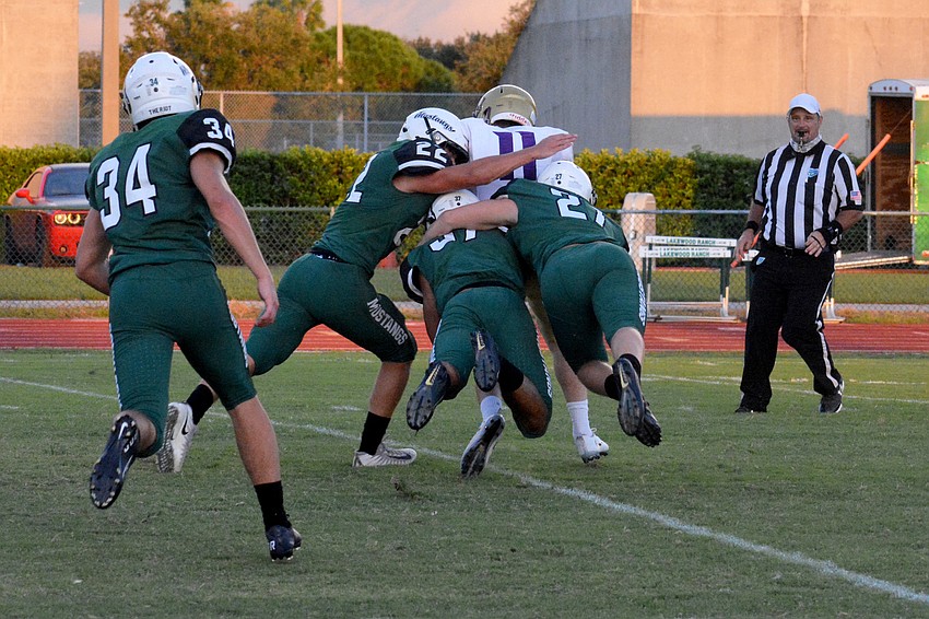 The Lakewood Ranch defense stuffs a Booker running back.