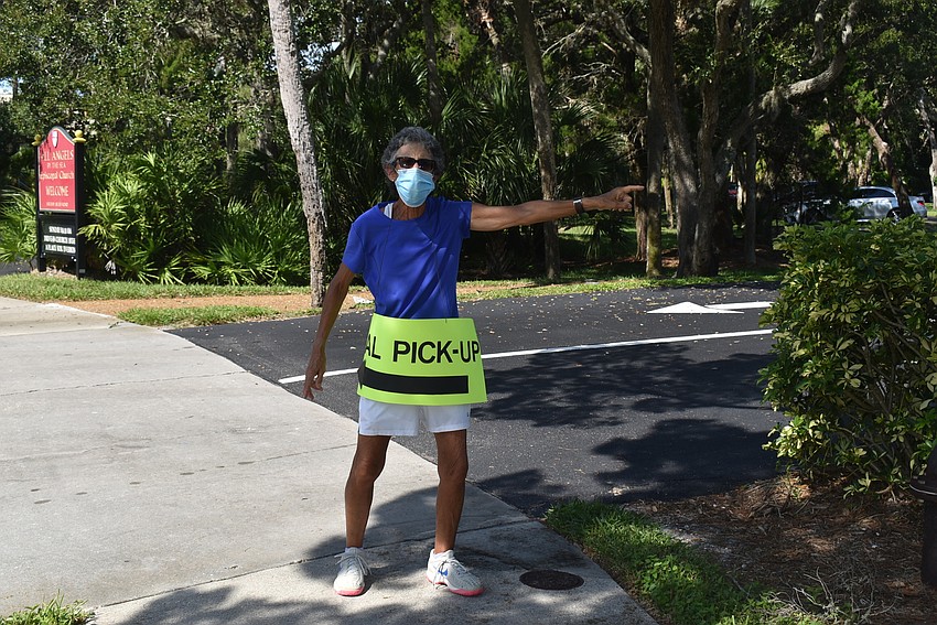 Max Spitzer kept traffic moving at the meal pick-up sector.