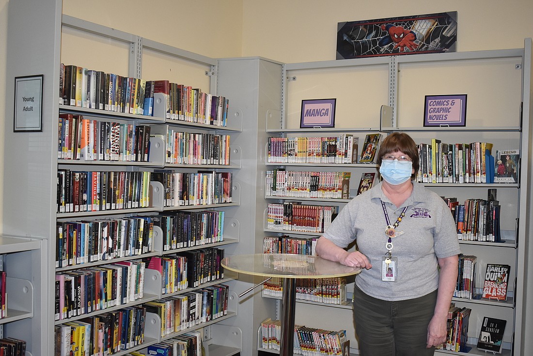 Cathy Laird, branch manager of the Braden River Library, shows off the main portion of the current young adult section. The revamped young adult section will be centered around a makerspace.
