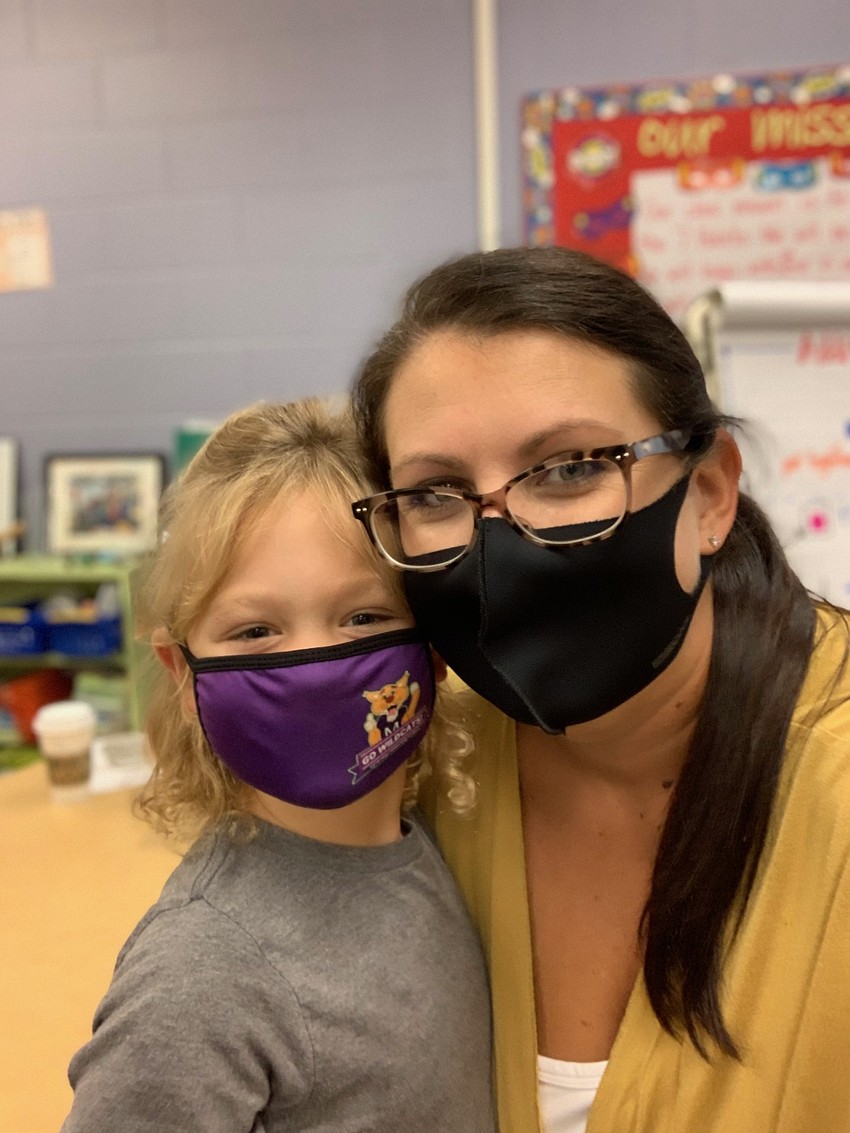 Charlotte Wells, a first grader at Gilbert W. McNeal Elementary, loves seeing her former kindergarten teacher, Jessica Spence.