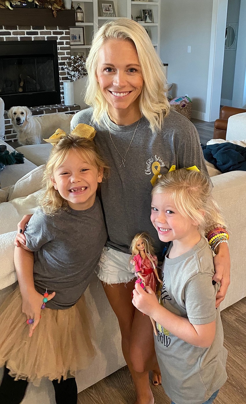 Panther Ridge's Charlotte Wells celebrates Go Gold Day with her mother, Rachel Wells, and her sister Savannah Wells.