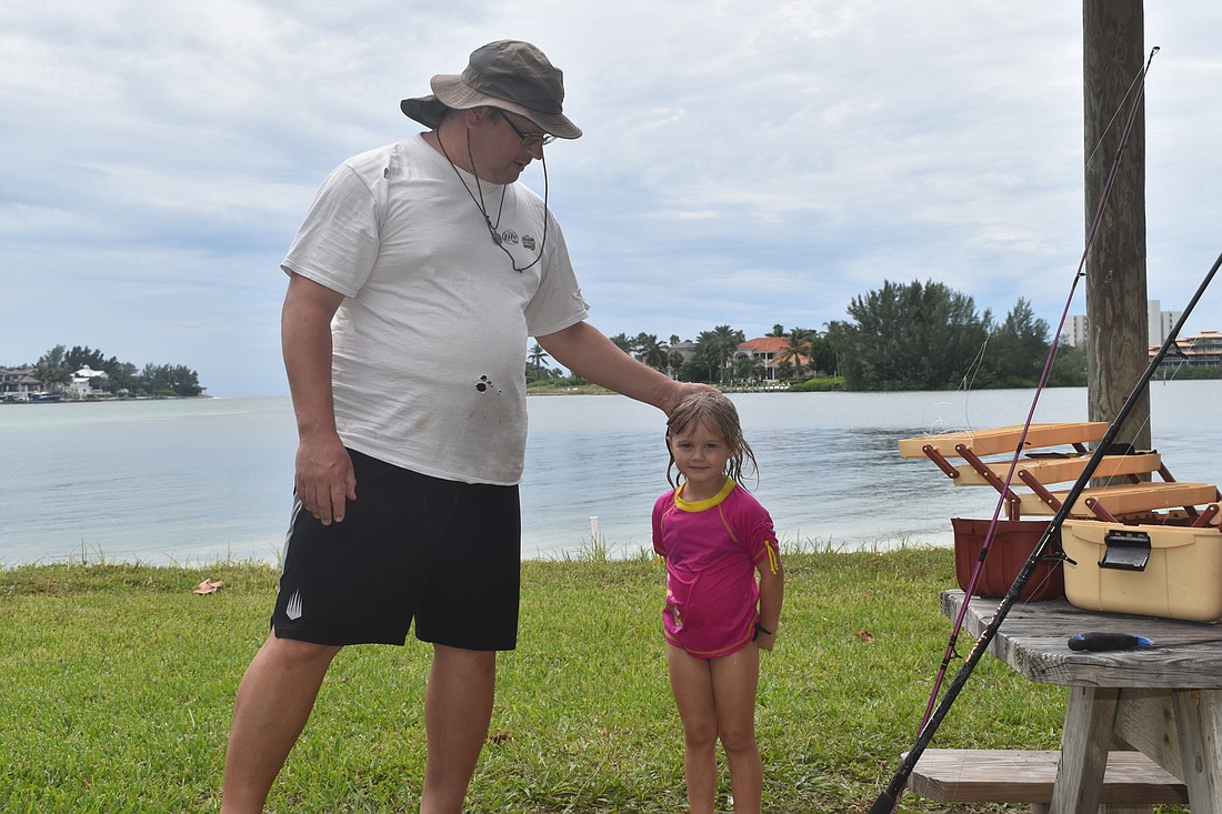Mark Veazey and his daughter went fishing on Friday at Overlook Park.