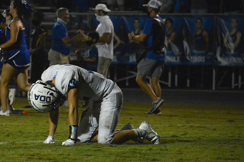 Michael Wyatt Carlton falls to his knees in the moments after the game ended.