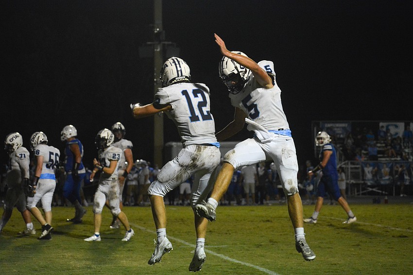 ODA's Michael Wyatt Carlton (12) and Tyler Beasley (5) celebrate after connecting on a touchdown pass.