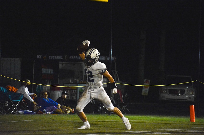 Michael Wyatt Carlton spikes the football after scoring a touchdown.