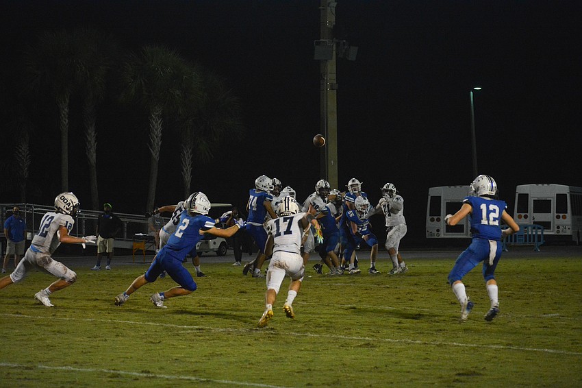 Connor Pope (17) breaks in front of a Canterbury pass. Pope would intercept the pass and return it into the red zone.
