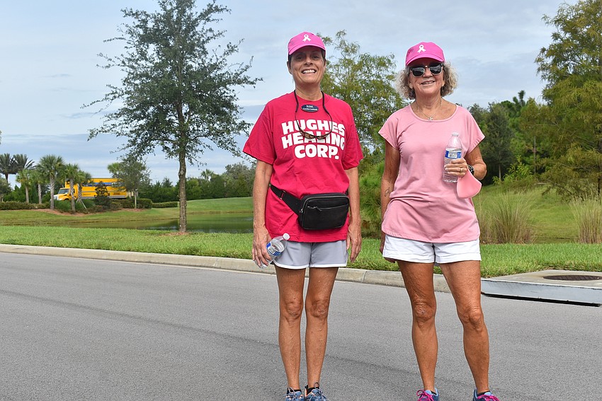 Cynthia Lambeth (left) and Ann Goldberg walked together. Lambeth's shirt reads 