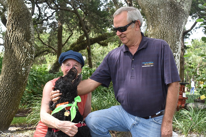Reba nearly stays still for a portrait with Ginny and Ed Upshaw.