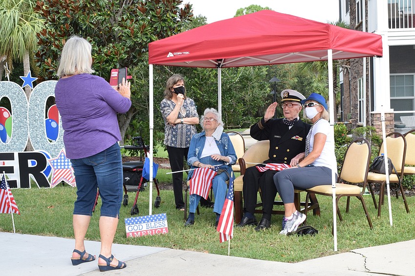 Jan Wright takes a photo of her sister Joy Bragg, mother, Margaret Quisenberry, father, Roger Quisenberry, and Linda Britt-Smith, activity coordinator at Cypress Springs Gracious Retirement Living.
