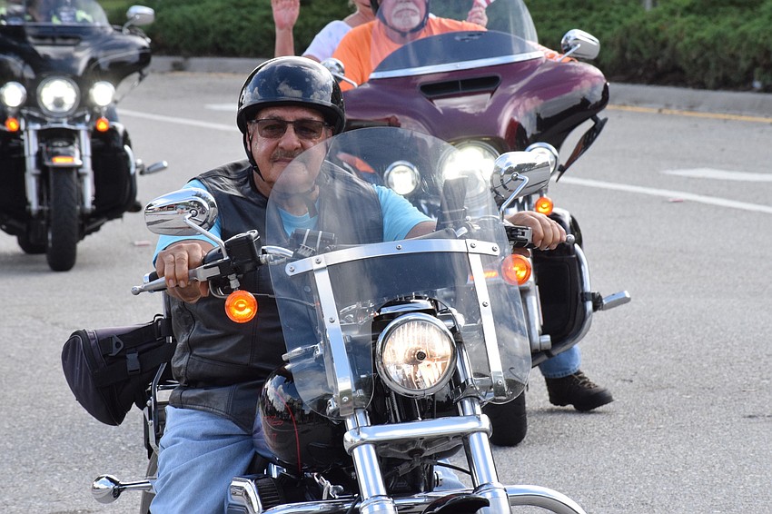 Phil Mobilio, a member of the Lakewood Ranch Elks Lodge, rides his motorcycle in the parade.