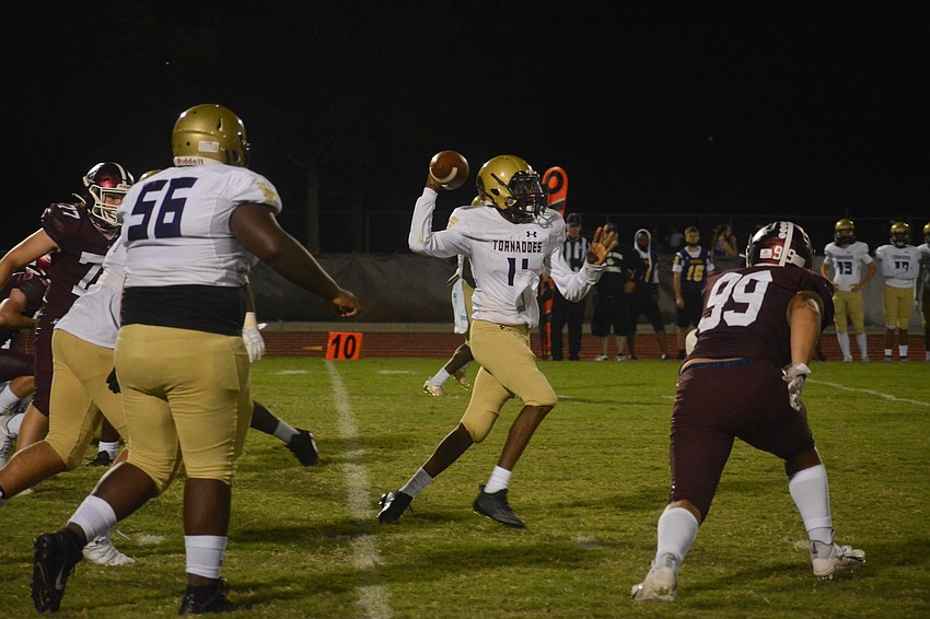 Booker quarterback King Winkfield fires a pass downfield.