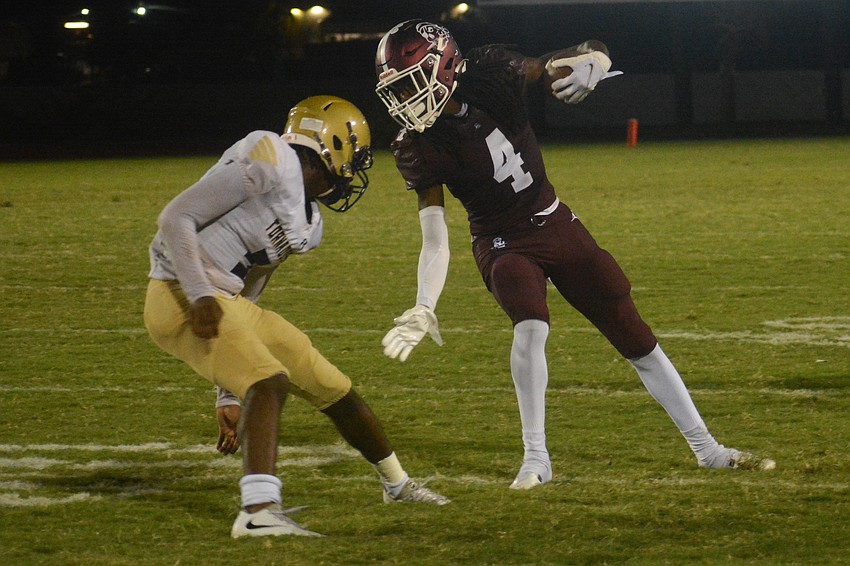 Pirates senior wideout Gregory Cotton jukes a Booker defender.