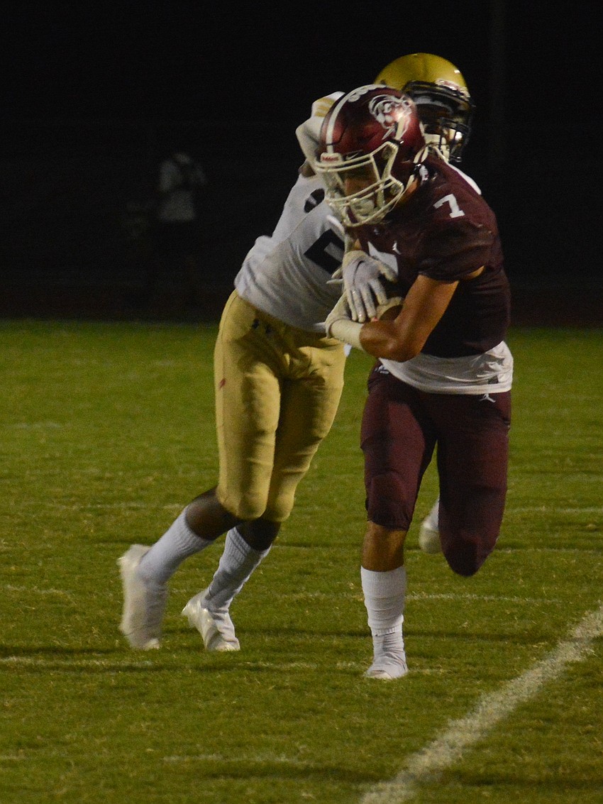 Pirates senior wideout Connor Losada tiptoes the sideline before going out of bounds.