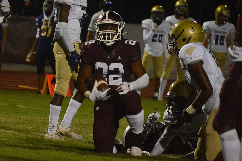Lavontae Youmans kneels after scoring his second touchdown of the game.