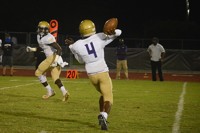 Booker quarterback King Winkfield throws a swing pass to a Tornadoes running back.