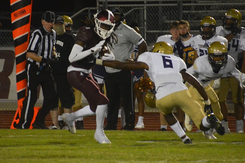 Gregory Cotton evades a Booker defender.