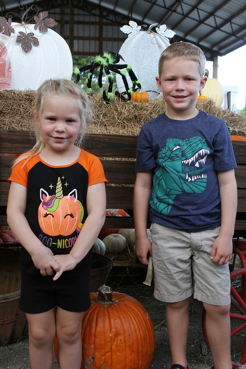 Aubrey and Connor Wilson posed with some pumpkins.