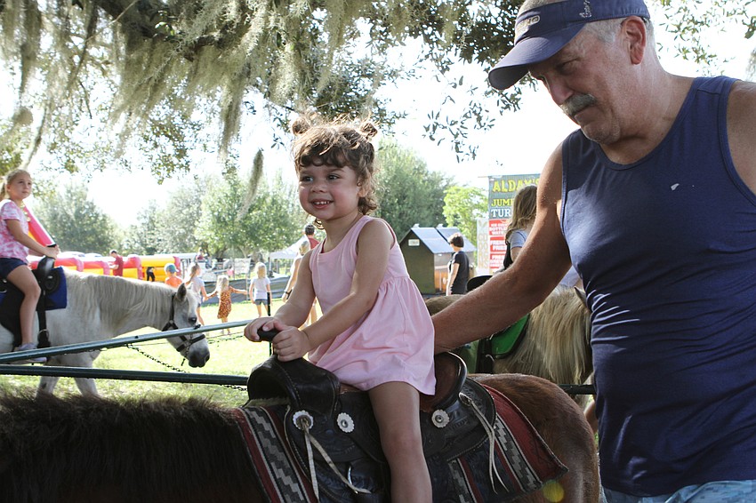 Abigail and Louie Martinet kept steady on the pony ride.