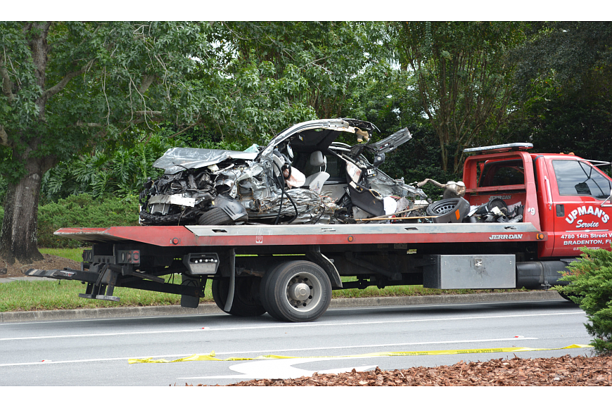 The vehicle separated into two pieces after crashing into a tree.