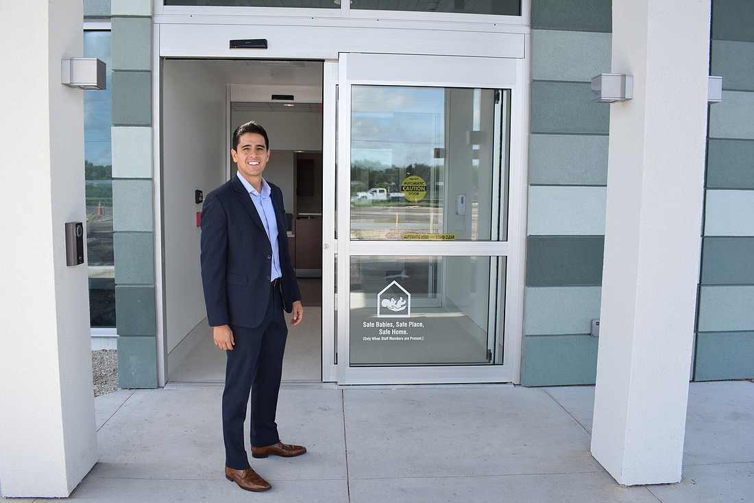 Diego Perilla, the chief operating officer of Lakewood Ranch Medical Center, stands at the front door of the new ER at Fruitville.