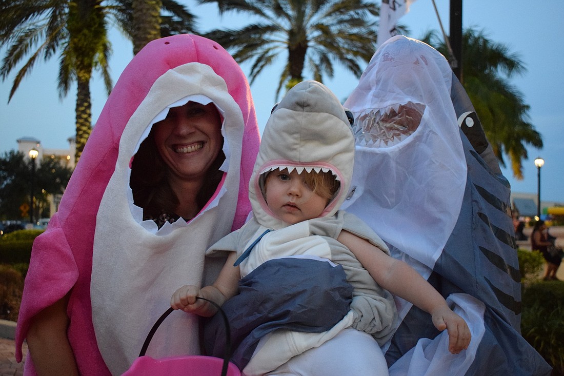 Lakewood Ranch residents Vaughna Wells, Kaija Thoyre, 16 months, and Sam Thoyre dress as sharks during BooFest on Oct. 21, 2019. In 2020, the event will be moved to Premier Sports Campus with a capacity of 250 people.