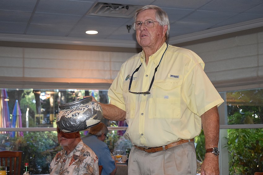 Bob Gault walked around the dining room with the Kiwanis pot for 