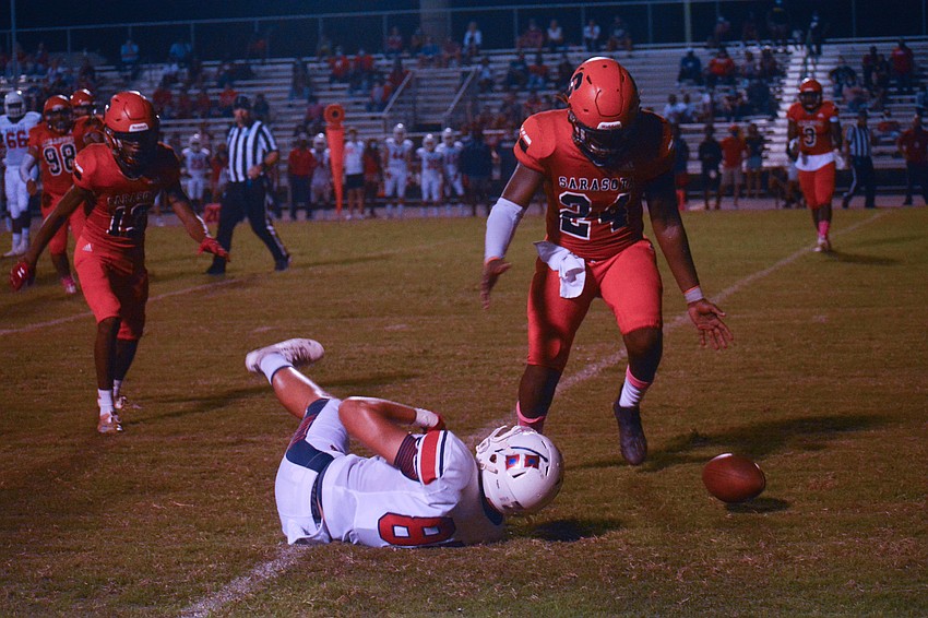Jamall Thompson (24) breaks up a Manatee pass.