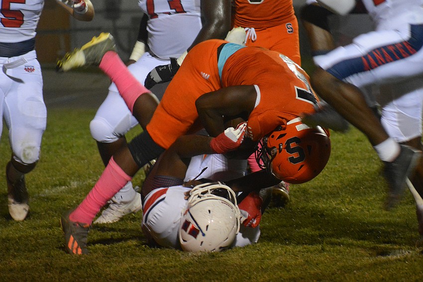 Jarmel Holloway bowls over a Manatee defender. 4