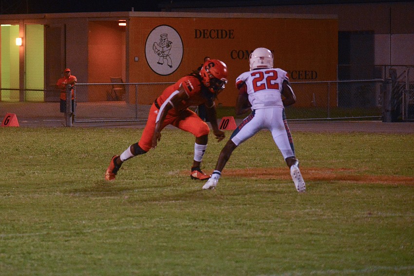 Terrell Pack puts a hit on a Manatee receiver. The hit caused a fumble, but the Manatee receiver was ruled down by contact.