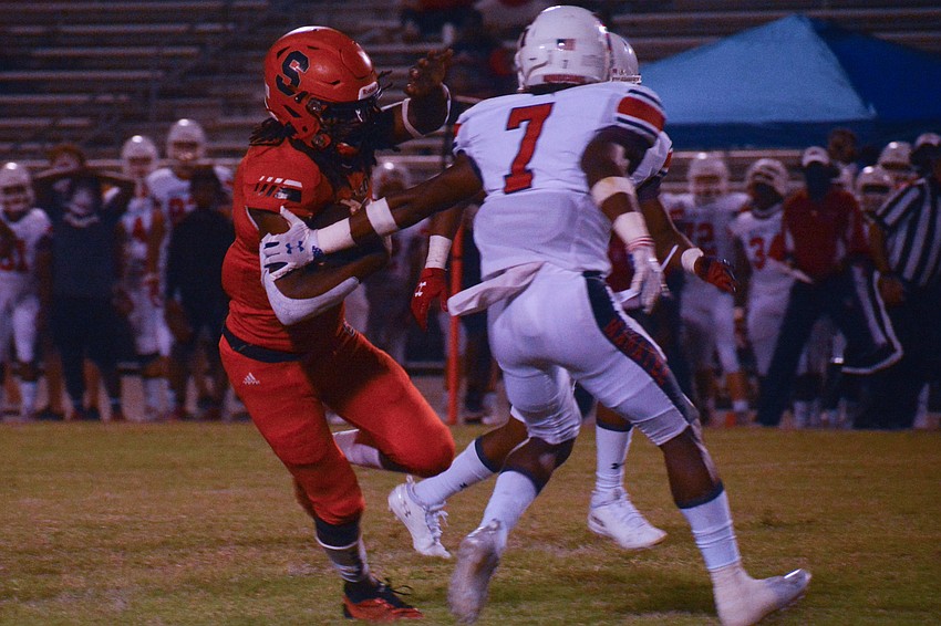 Terrell Pack dekes a Manatee defender on his way to the end zone for a long touchdown.