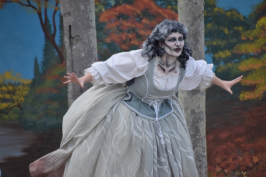 The Woman in White (Yvonne Clark) spooks the audience.