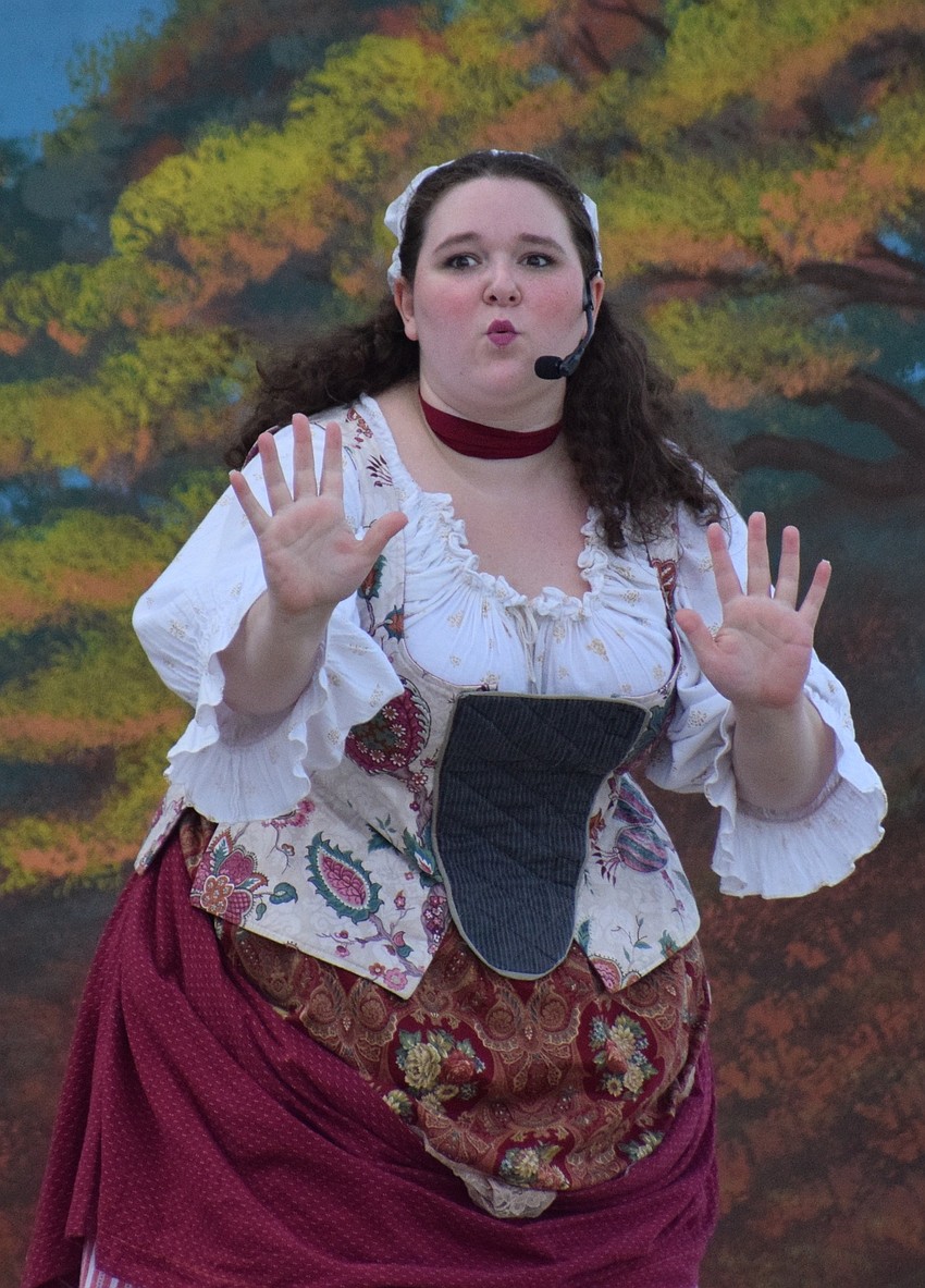 Greta (Emily Eader) talks to others about the Headless Horseman.