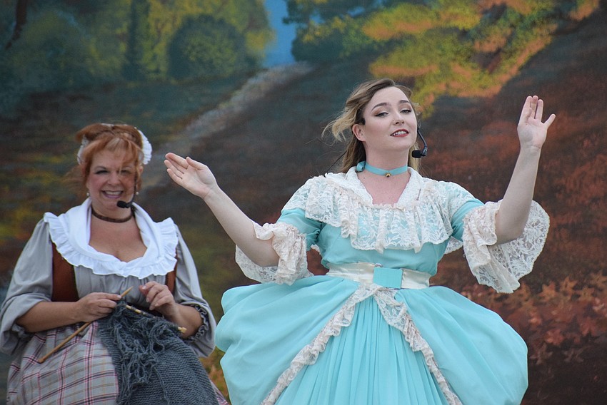 Widow Van Doorn (Andrea Keddell) and Katrina Van Tassel (Brenna Griffith) talk about the Headless Horseman.