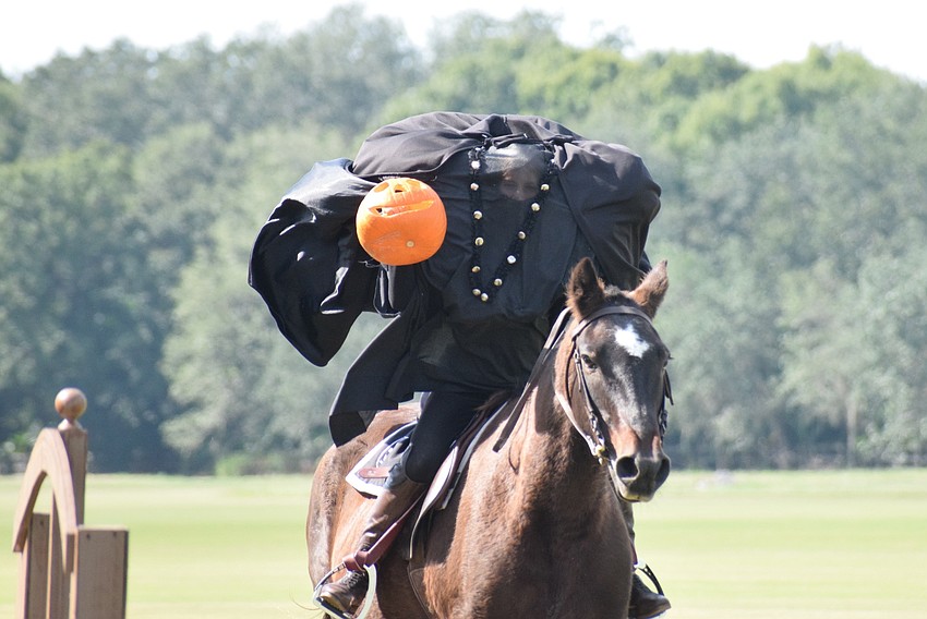 The Headless Horseman (Carmen Hansen) surprises the audience.