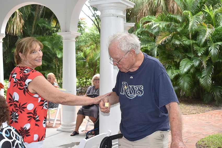 Valerie Evanko sees John Brill off.