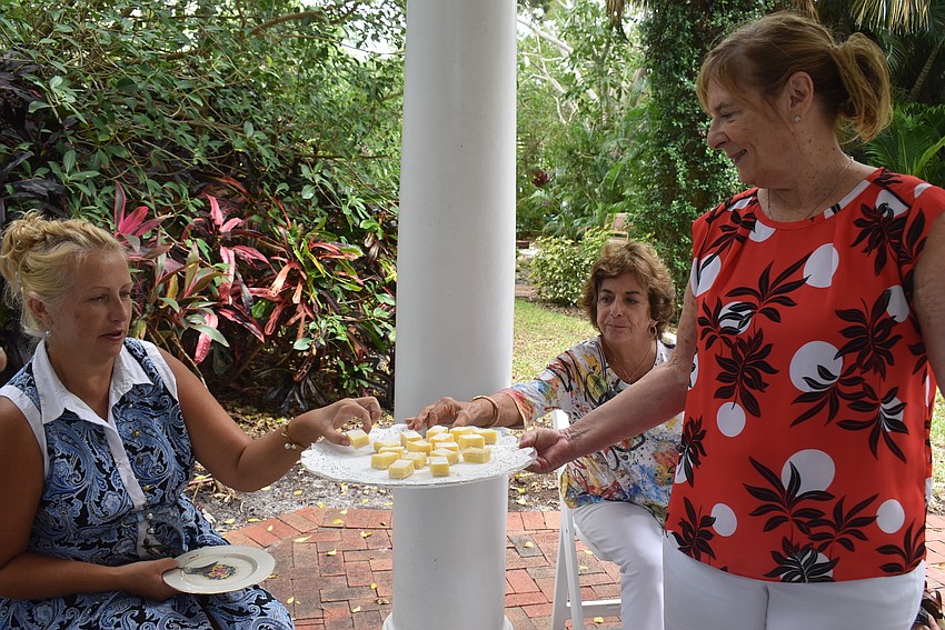 Valerie Evanko serves lemon pastries.