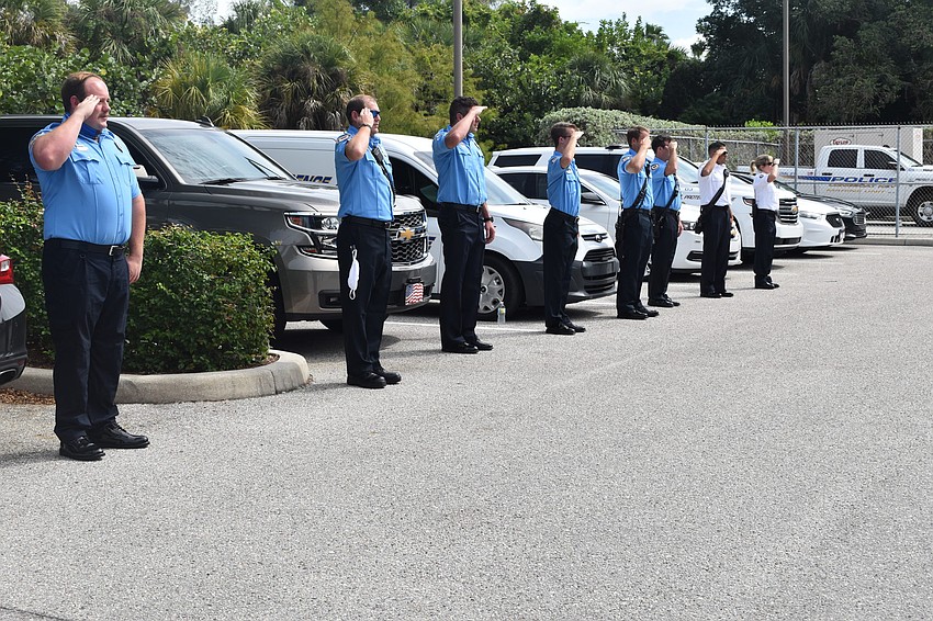 Police officers and firefighters saluted Pete Cumming and his wife Diane as they drove off together in retirement.