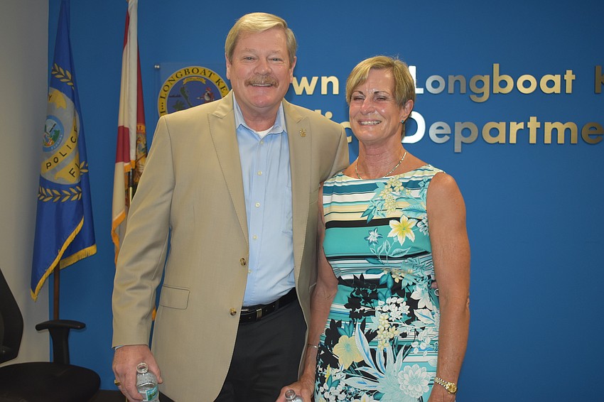 Pete Cumming and his wife Diane pose for a picture during Friday afternoon's retirement ceremony.