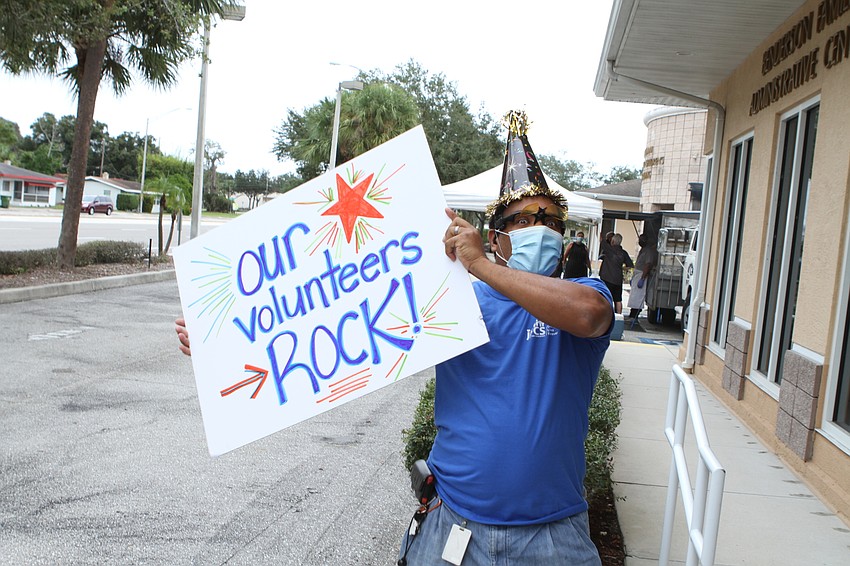 Jose Guerro held up a sign for oncoming drivers.