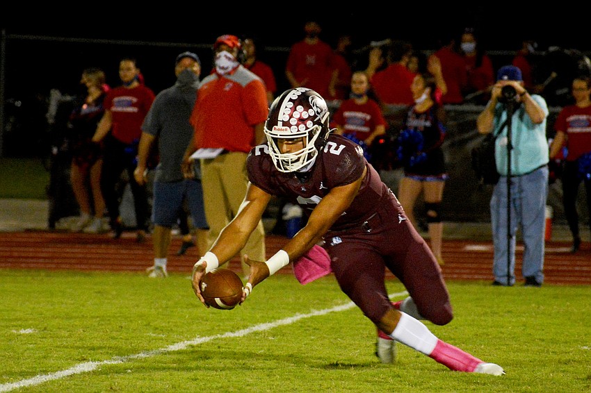 Shawqi Itraish falls on a fumble after a high snap, preventing a turnover.