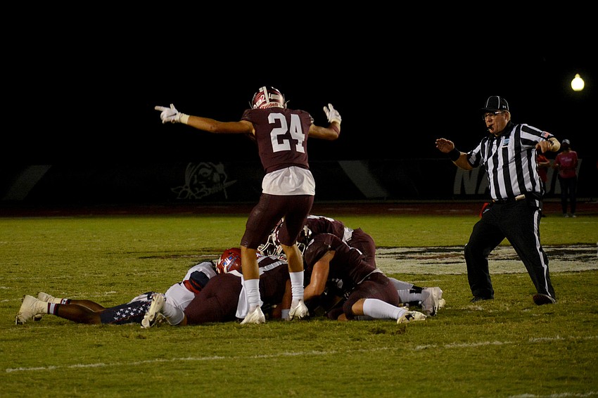 Tanner Wolfe (24) signals Braden River ball after Matt Manning recovered a muffed punt.