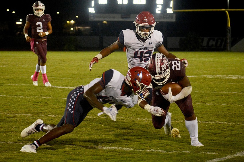 Lavontae Youmans barrels through a Manatee defender.