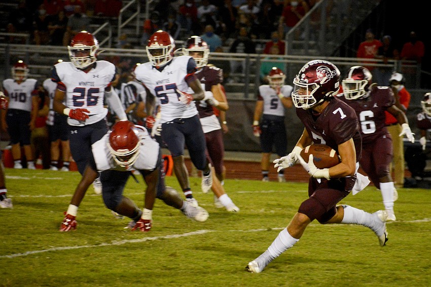 Conner Losada returns a punt for Braden River High.