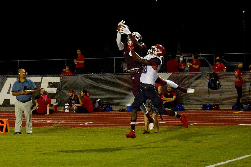Gregory Cotton snares a touchdown pass from Shawqi  Itraish.