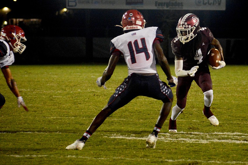 Braden River's Gregory Cotton (4) makes a move on Manatee's Jayden Corbett (14).