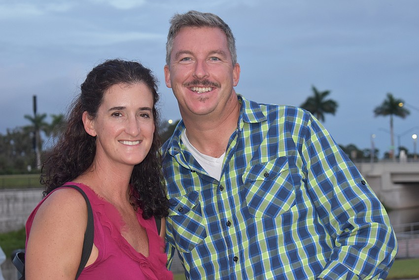 Kristin Merritt (left) and Aaron Merritt of Nokomis heard of Fiesta Friday through a Sarasota events calendar. With less going on these days, they said they've gotten more creative about finding things to do.