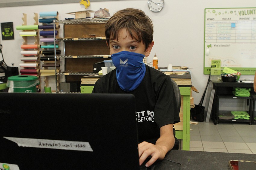 Barrett Swafford looked for designs for his pumpkin.