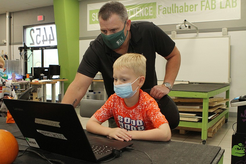 Josh and Titan Newman paid close attention.