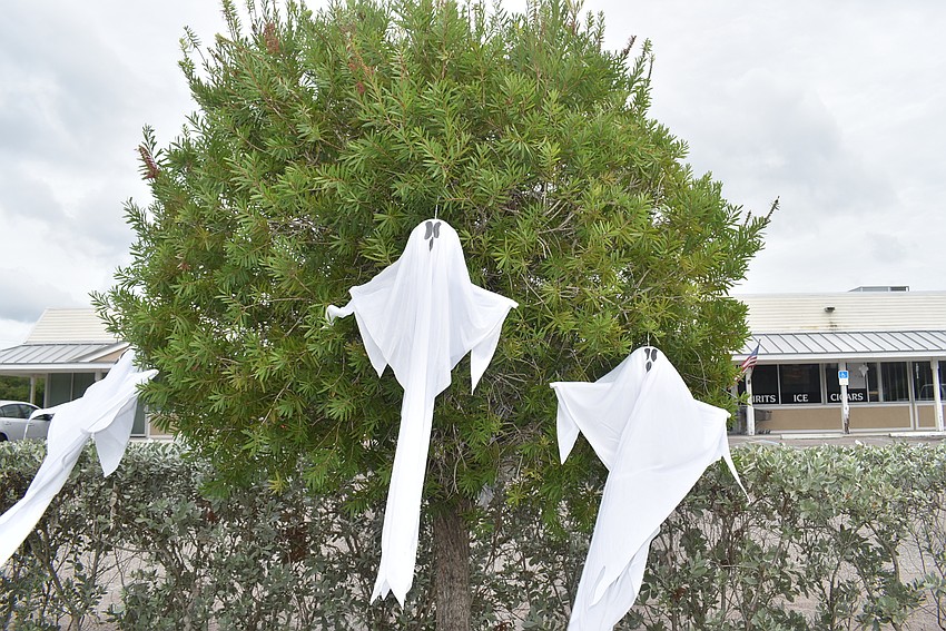Ghastly ghosts stand watch outside Chubby's Lounge on Gulf of Mexico Drive.